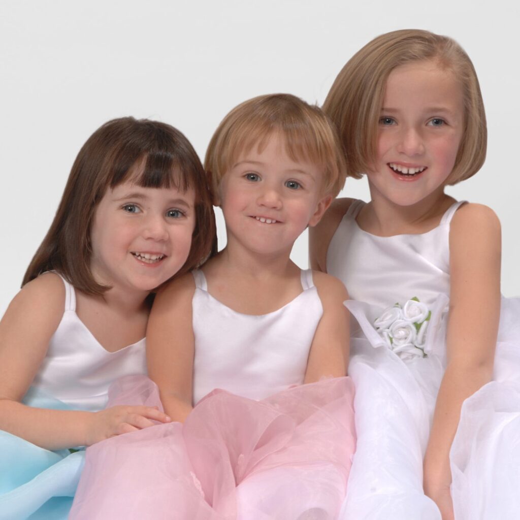 Three young girls in dresses