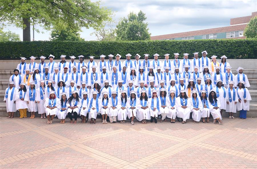 A large class posing in their graduation caps